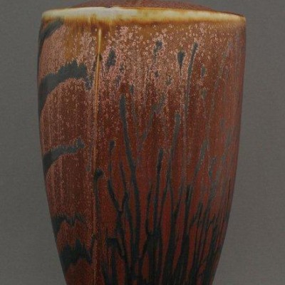 urn with black brushwork
