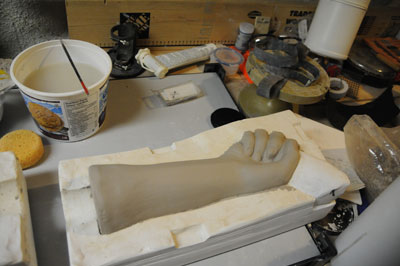 One side of the cast has been removed, if the piece is dry enough, carefully pull the sculpture out from the second part of the mold