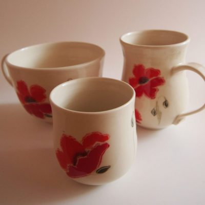 Three porcelain mugs painted with red poppies - Priya Harding