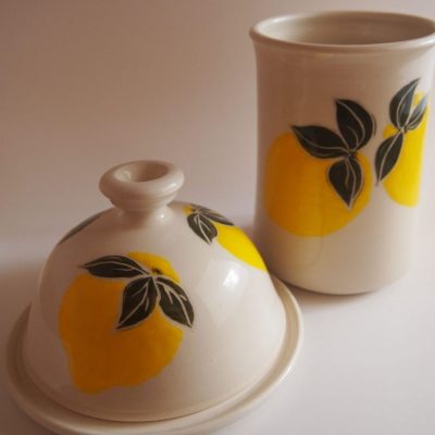 White porcelain butter dish & mug painted with yellow lemons and green leaves - Priya Harding