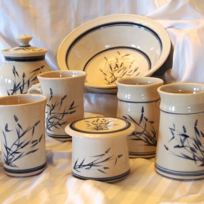 White porcelain mugs, bowl, jar and butter dish with blue brushwork grasses - Priya Harding