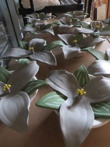 table of white trilliums hand made by volunteers