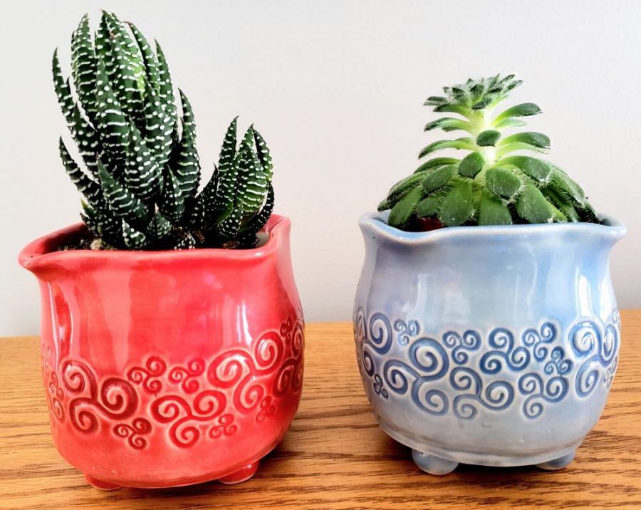 red and blue decorated planters
