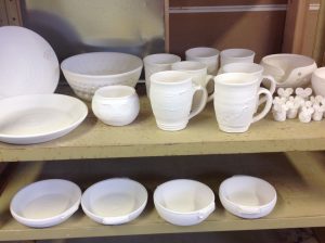 shelves of white bisque ware