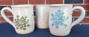3 mugs decorated with queen anne's lace imprint in different colours