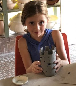 One of our week 1 campers building her castle shaped candle holder