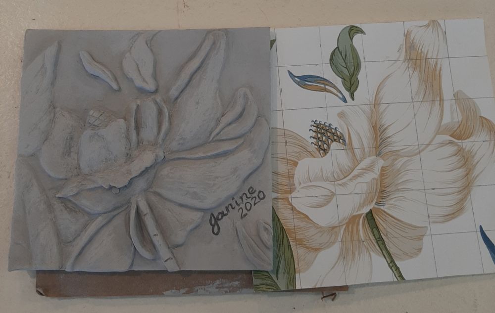Carved tile showing flower relief - example of surface decoration possibilities
