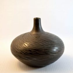 Decorative carved pit fired vase, polished black - Dan Ferguson