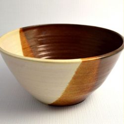 Deep bowl with red brown and white glazes, turning gold where overlapping - David Baker