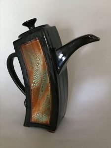 extruded rectangular leaning teapot in black glaze with textured coloured glaze - Bandurchins