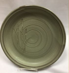 green plate with carved circles and bullrushes - Liz Sine
