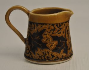 syrup jar with carved maple leaves - Karina Bates