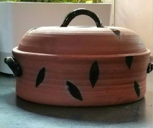 red and black casserole with lid - Maureen Reed