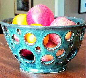 blue Fruit bowl with large decorative holes in varying sizes cut through - Maureen Reed