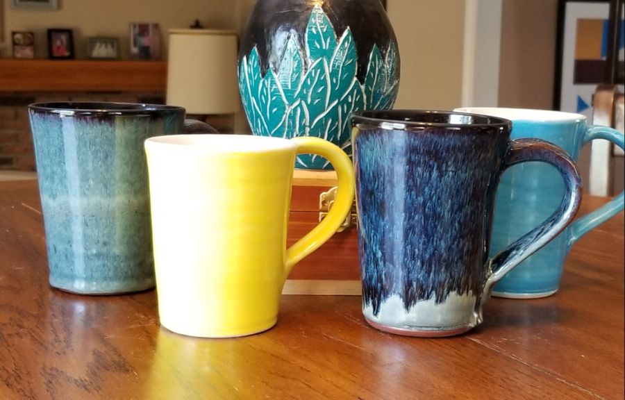 a variety of mugs in blue, yellow and grey - Maureen Reed