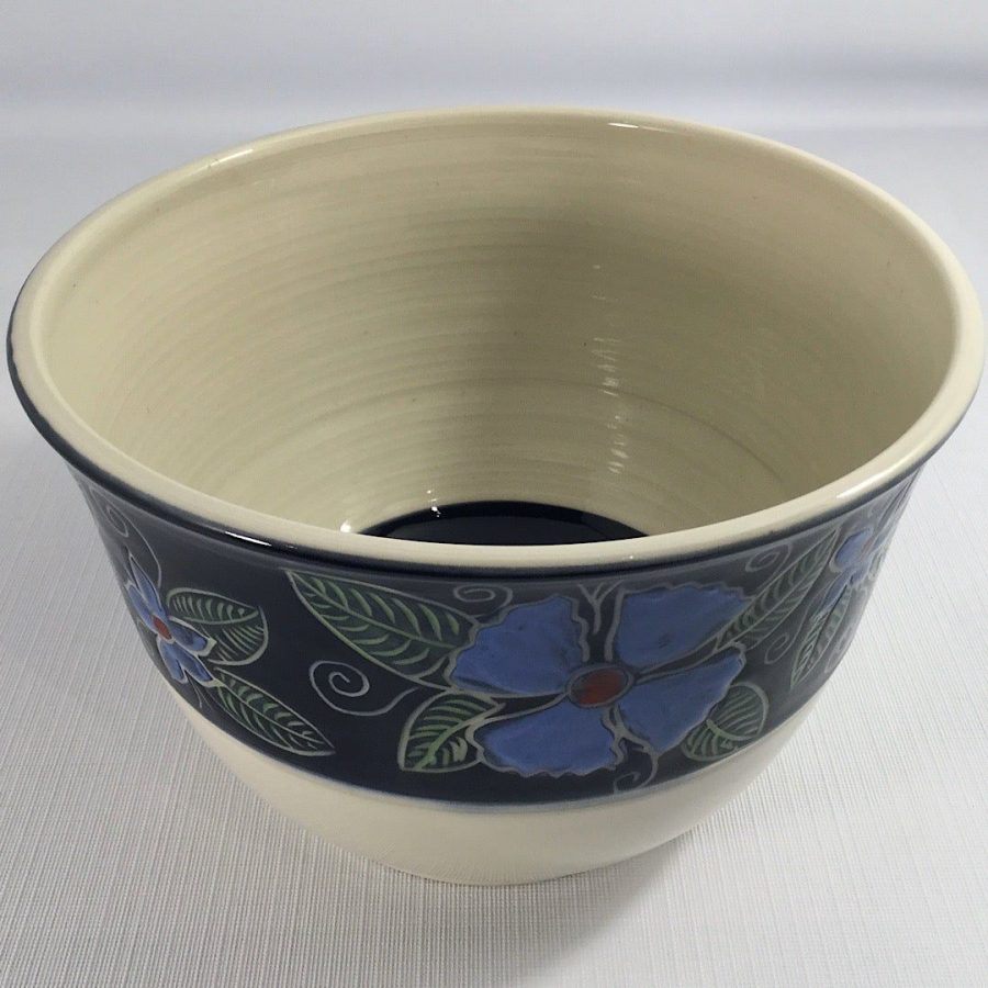 large bowl with black exterior band with blue carved flowers and green leaves - cathy allen