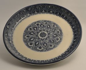 Blue and white carved plate in mandala design - Karina Bates